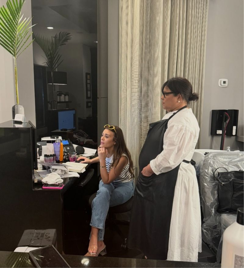 Rachel guiding a stylist through her salon systems